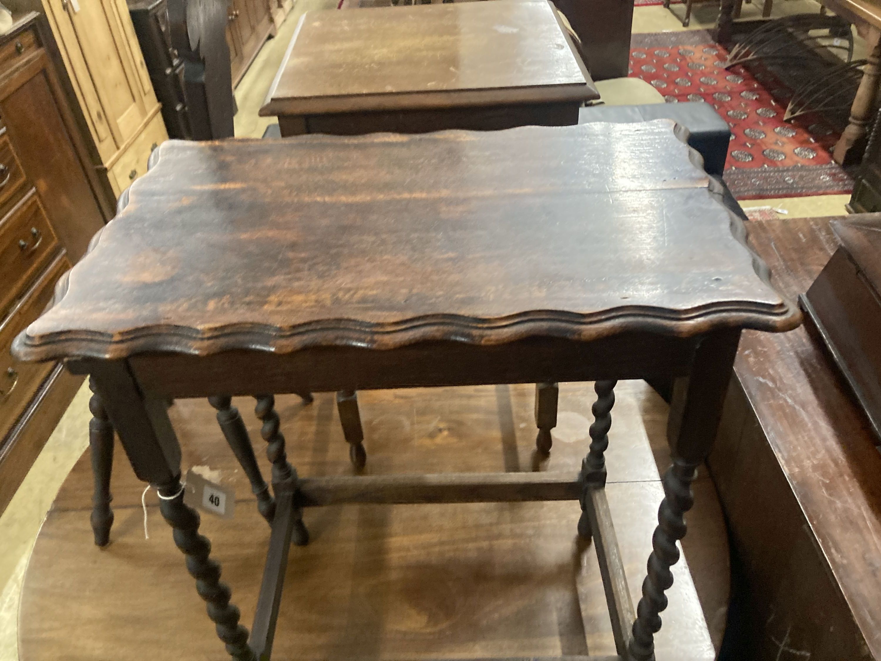 Two 1920s oak occasional tables, larger width 60cm, depth 37cm, height 72cm, together with a carved oak spinning chair